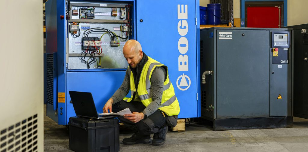 A&B AirSystems worker checking technology with a toolbox